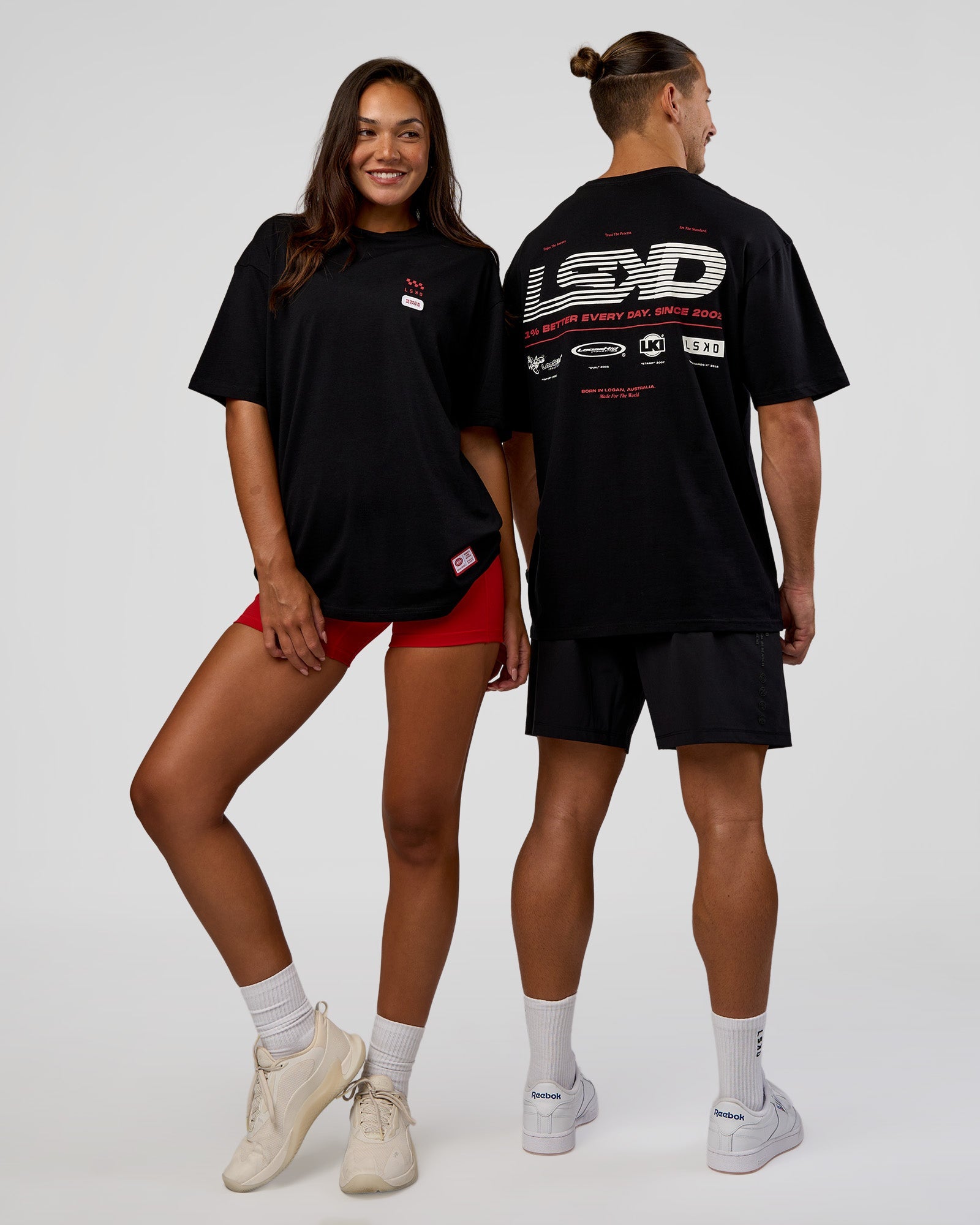 Duo wearing Archive FLXCotton Oversized Tee - Black-Scarlet | Model:Both | Size:Duo