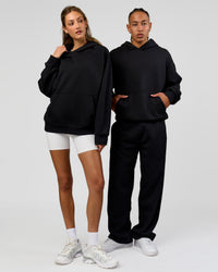 Duo wearing Base Oversized Hoodie - Shale Beige | Model:Georgia| Size:XS | Model:Malebo| Size: M | | Thumbnail Index: 8