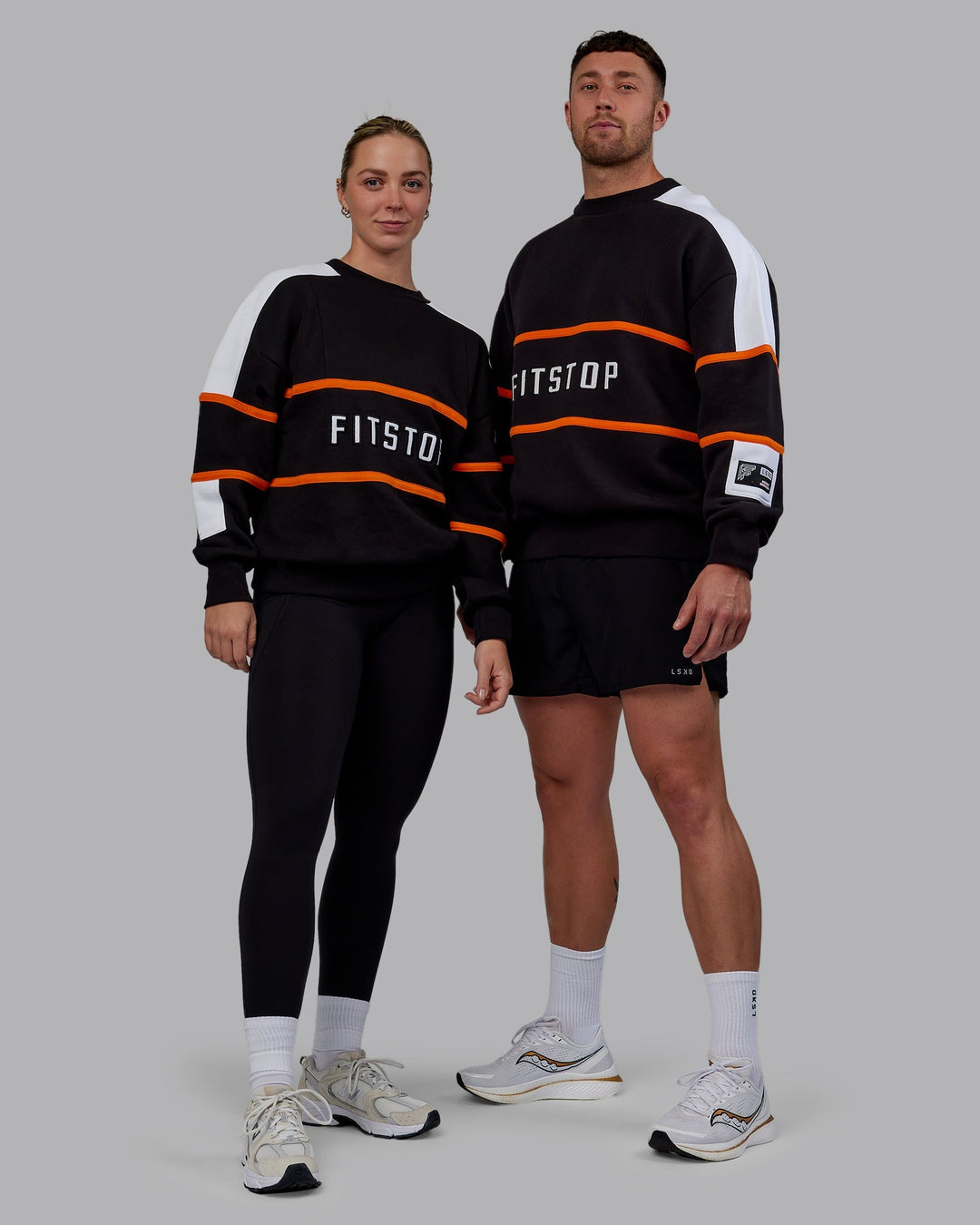 Duo wearing Unisex Fitstop Move More Sweater Oversize - Black-White