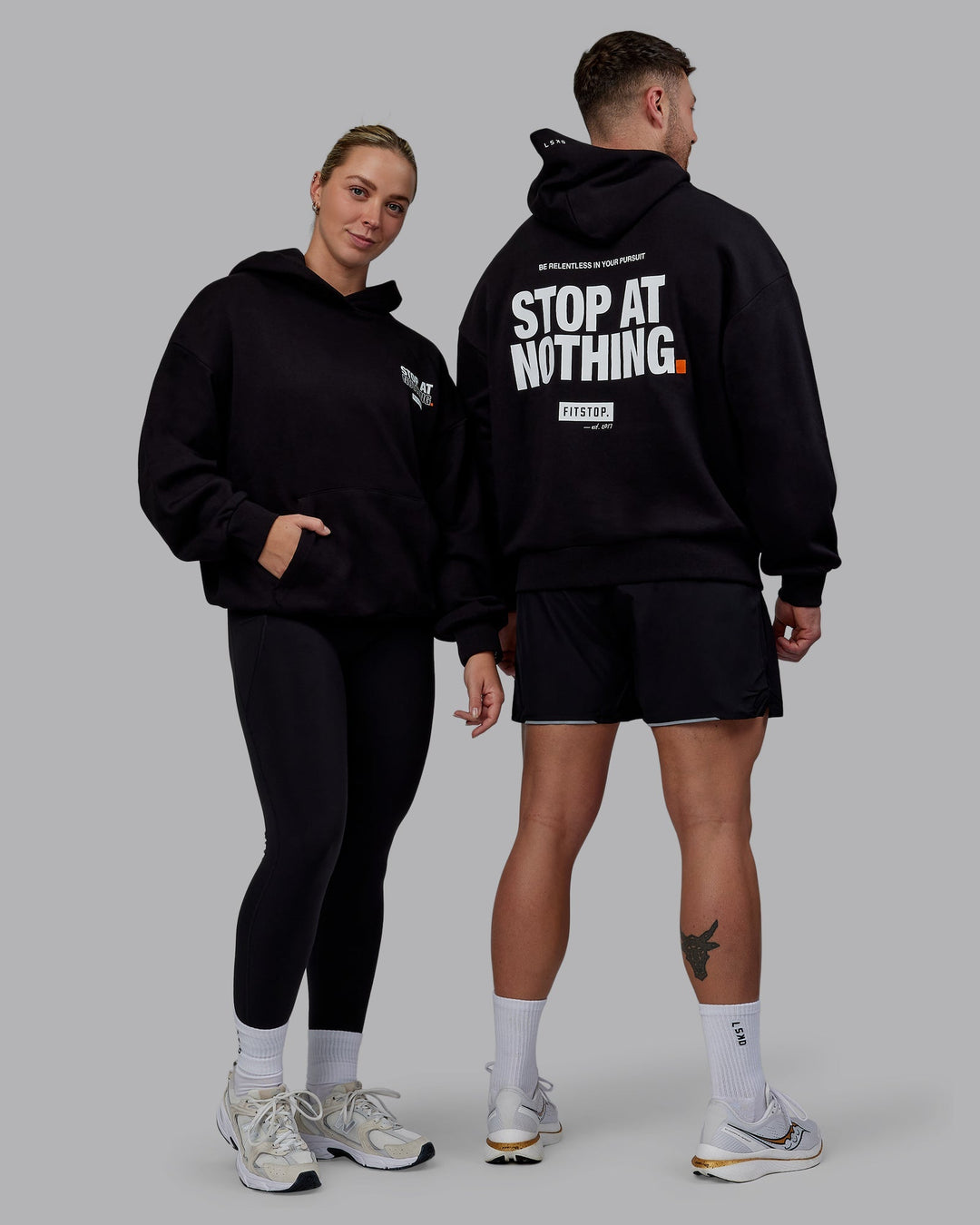 Duo wearing Unisex Fitstop Stop at Nothing Hoodie Oversize - Black