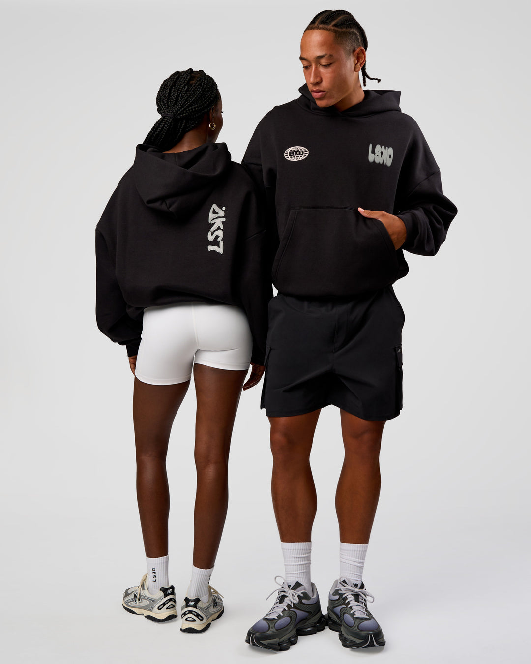 Duo wearing Static Grit Unisex Boxy Hoodie - Black-Alloy | Model:Both | Size:Duo