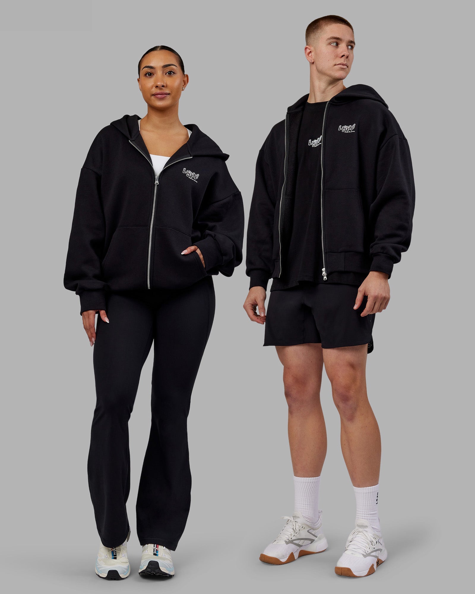 Duo wearing Time's up Unisex Oversized Zip Hoodie - Black-White | Model:Both | Size:Duo
