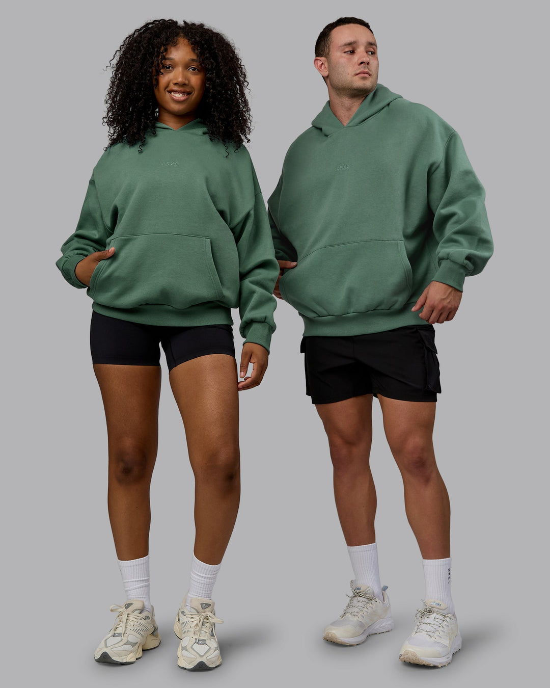 Duo wearing Unisex MVP Hoodie Oversize - Sage Brush