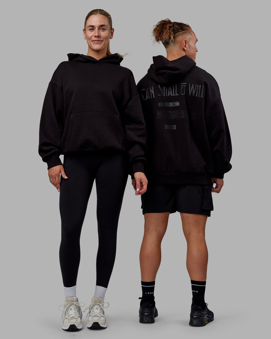 Duo wearing Sara Unisex Hoodie Oversize - Black-Black