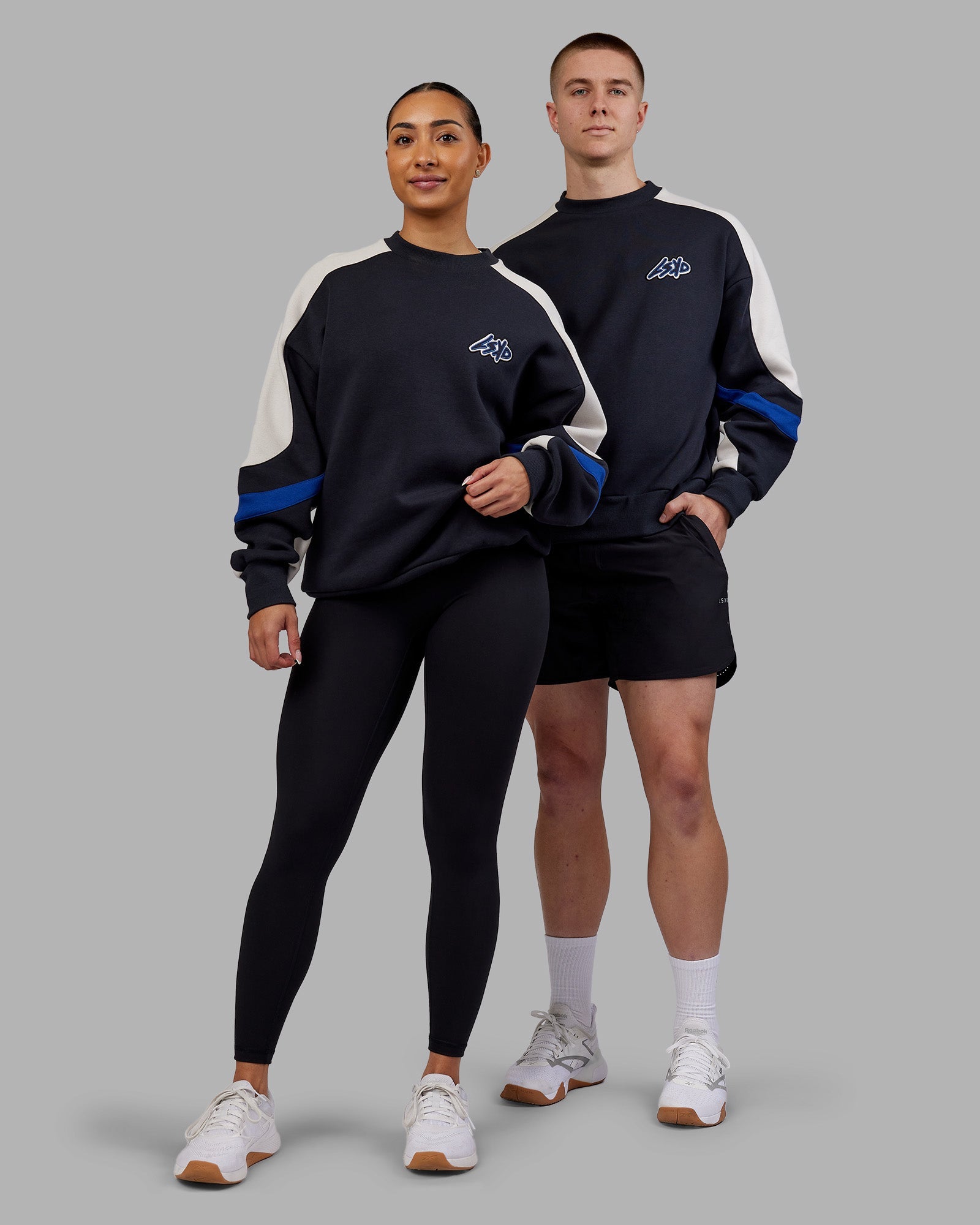 Duo wearing Vibe Oversized Unisex Sweater - Caviar-Midnight Blue | Model:Both | Size:Duo