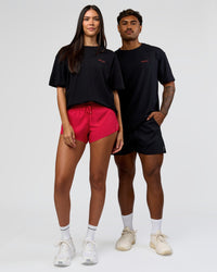 Duo wearing RUN CLUB FLXCotton Tee Oversize - Black-Scarlet | Model:Xav | Size:L | Model:Rhiley | Size:XS