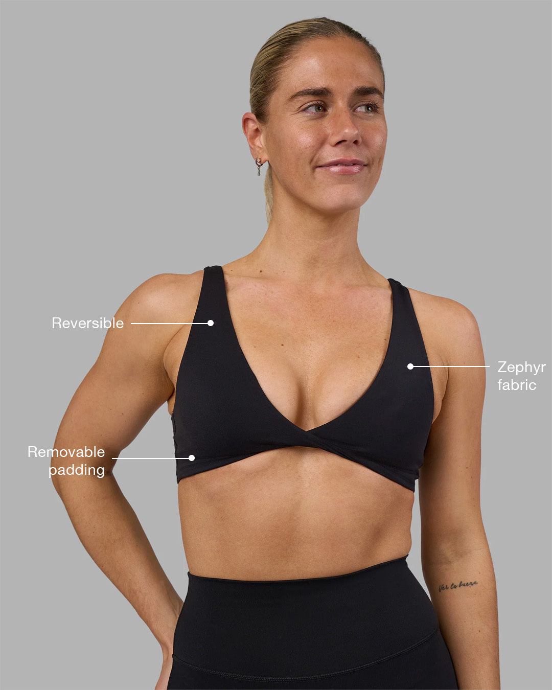 Woman wearing Impulse Reversible Sports Bra - Black | Model:Hannah | Size:S
