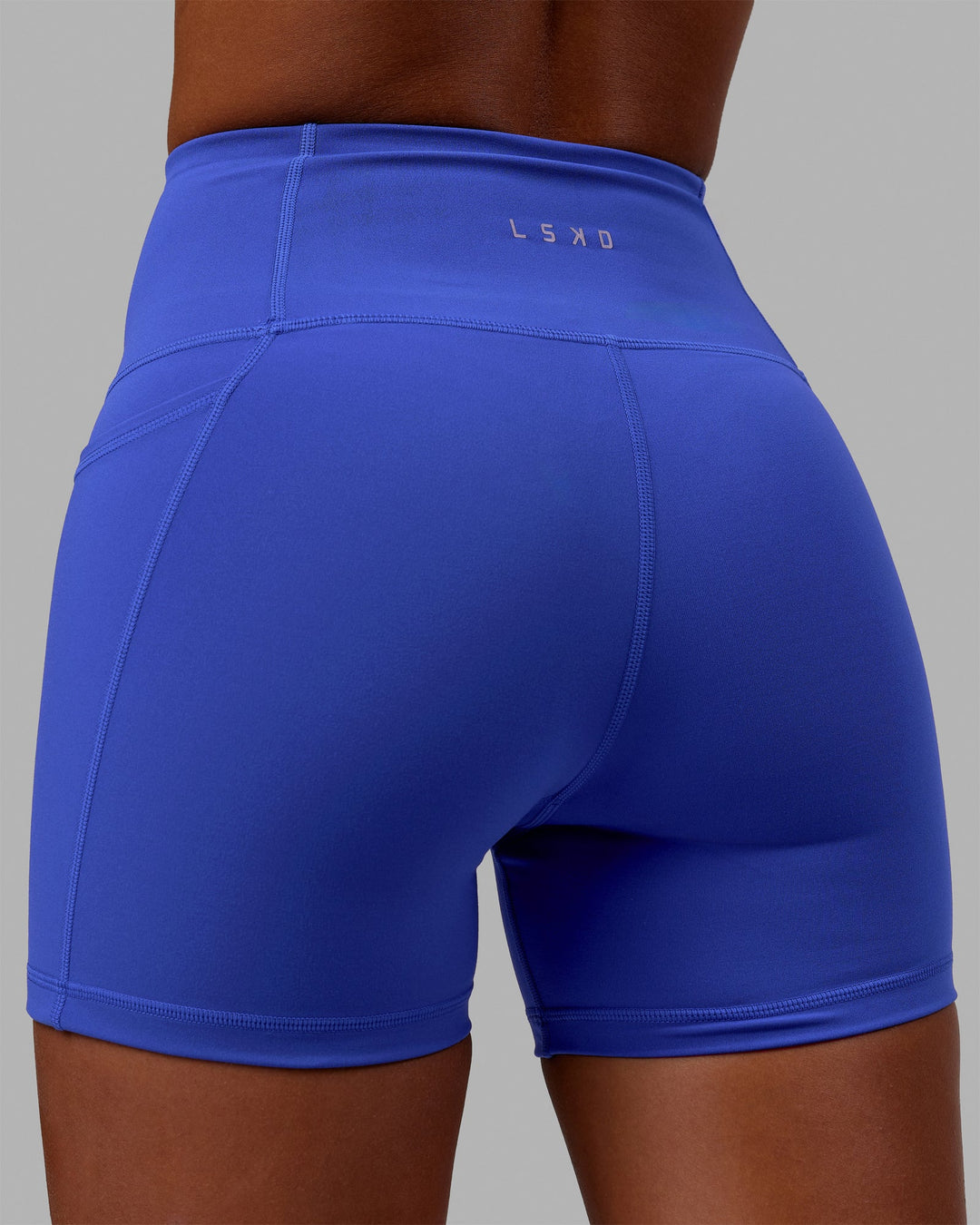 Woman wearing Flux Ultra High-Rise 4" Short Pockets - Power Cobalt