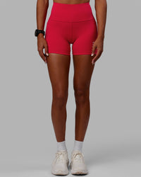 Woman wearing Flux Ultra High-Rise 4" Short Pockets - Scarlet