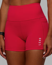 Woman wearing Flux Ultra High-Rise 4" Short Pockets - Scarlet