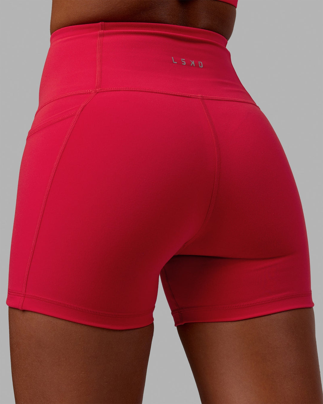 Woman wearing Flux X-Length Shorts - Scarlet