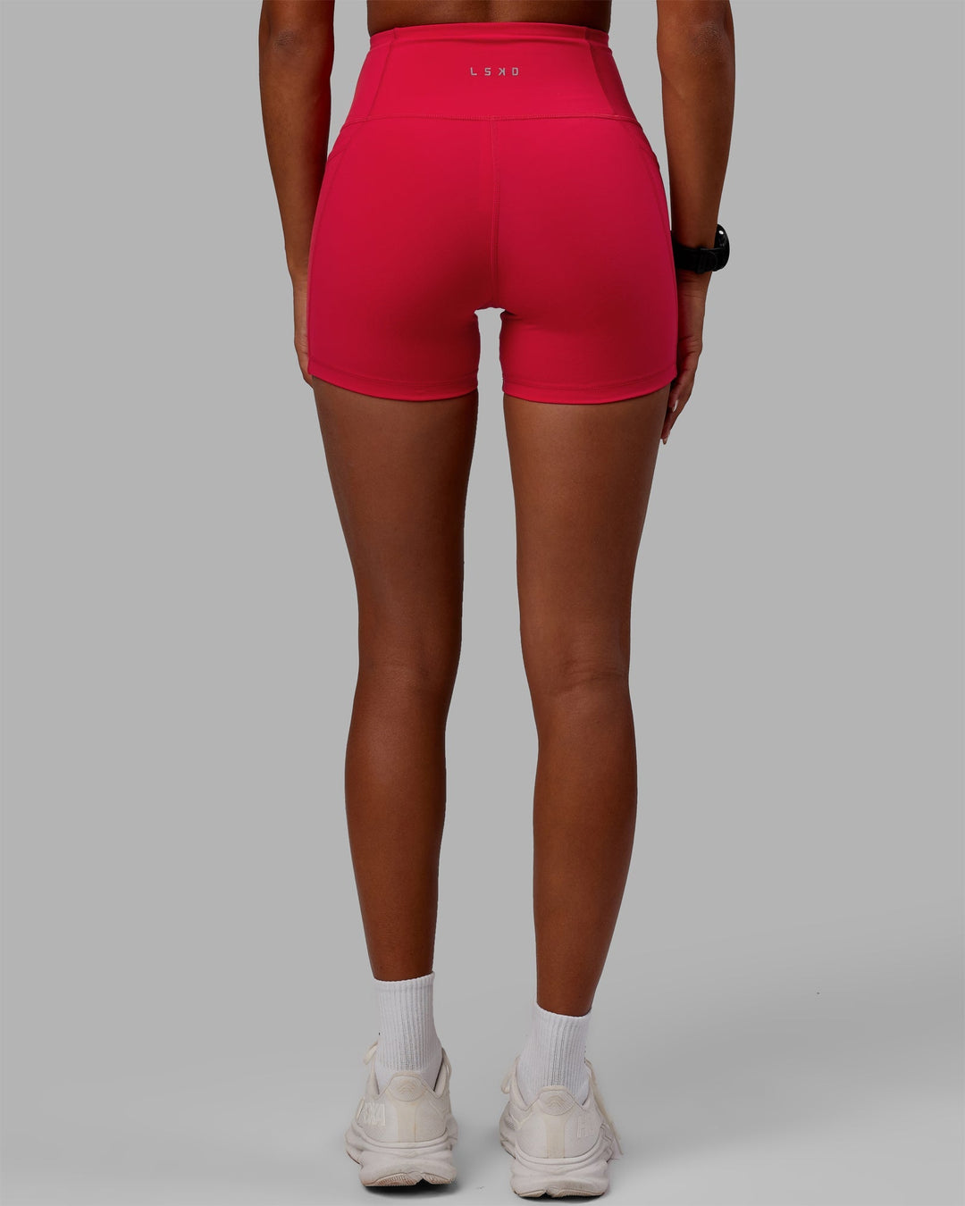 Woman wearing Flux X-Length Shorts - Scarlet