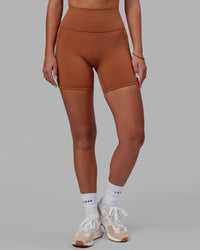 Woman wearing Fusion Ultra High-Rise 6" Short Pockets - Hazel | Set:true | Angle:front | Model:Milly | Size:S | Thumbnail Index: 1