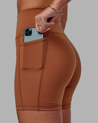 Woman wearing Fusion Ultra High-Rise 6" Short Pockets - Hazel | Set:true | Angle:closeup | Model:Milly | Size:S | Thumbnail Index: 4