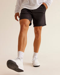Man wearing All Day ZeroCrease™ Regular 8" Short - Black | Model:Jackson | Size:34
