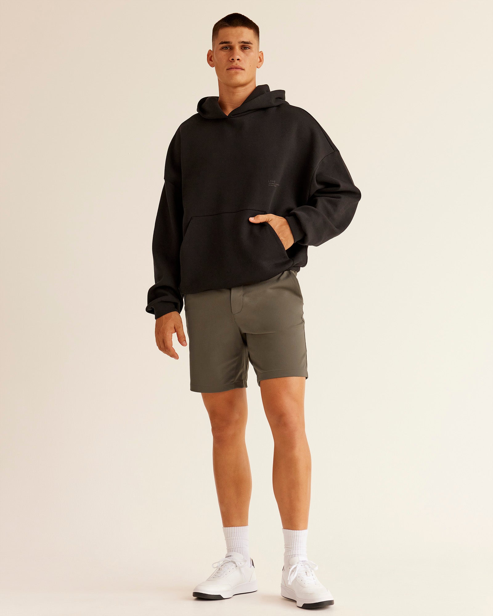 Man wearing All Day ZeroCrease™ Regular 8" Short - Walnut Grey | Model:Jackson | Size:34