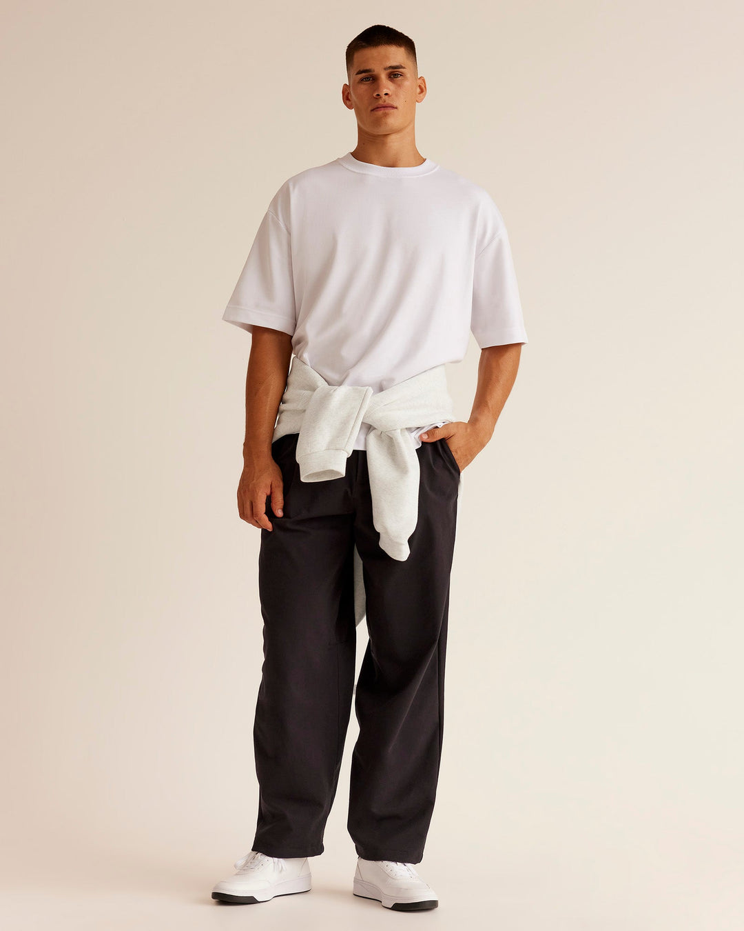 Man wearing All Day ZeroCrease™ Wide Leg Pant - Black | Model:Jackson | Size:34