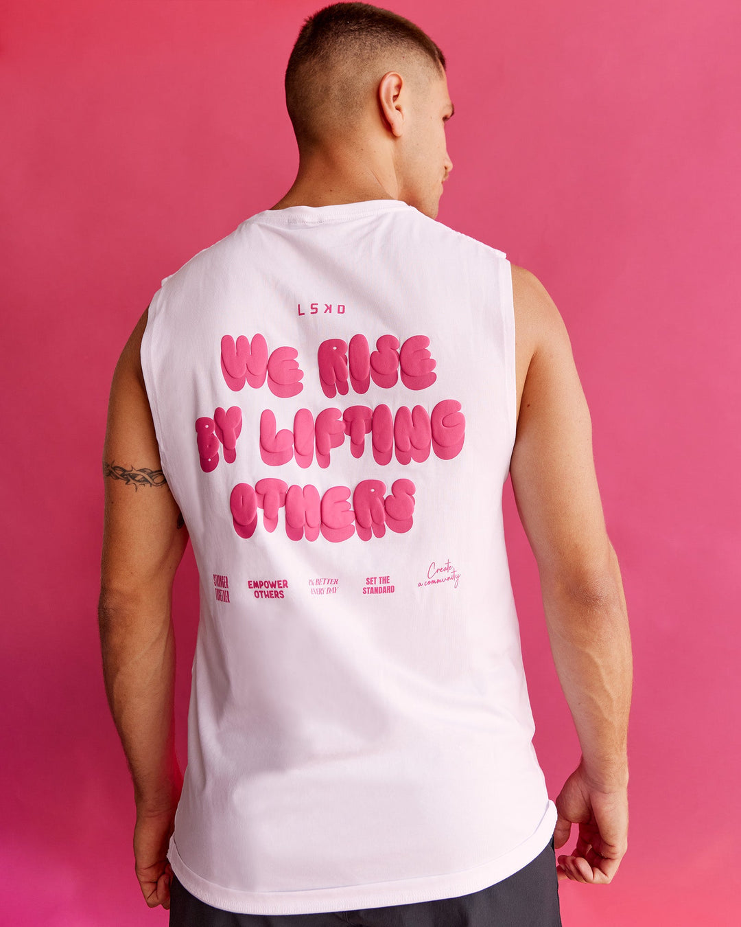 Man wearing BCAM FLXCotton Muscle Tank - White-Ultra Pink | Model:Nikola | Size:L