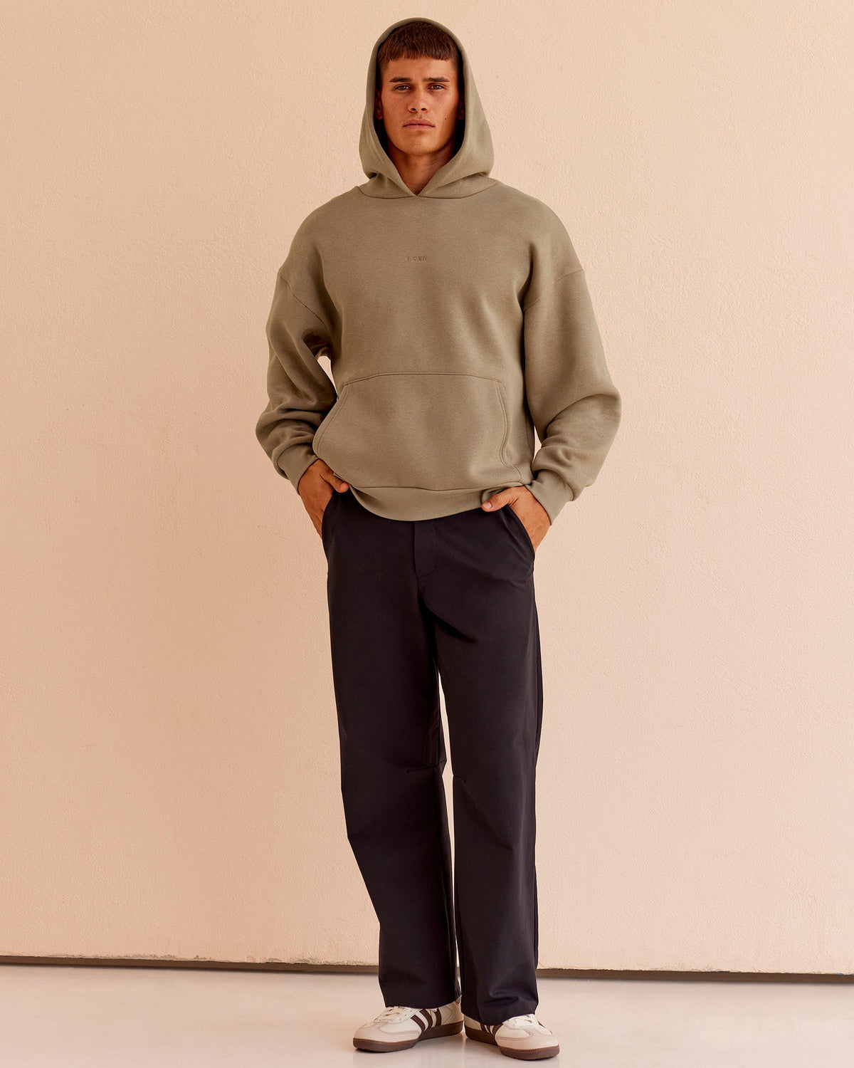 Man wearing Base Oversized Hoodie - Taupe Ash | Model:Jackson | Size:L