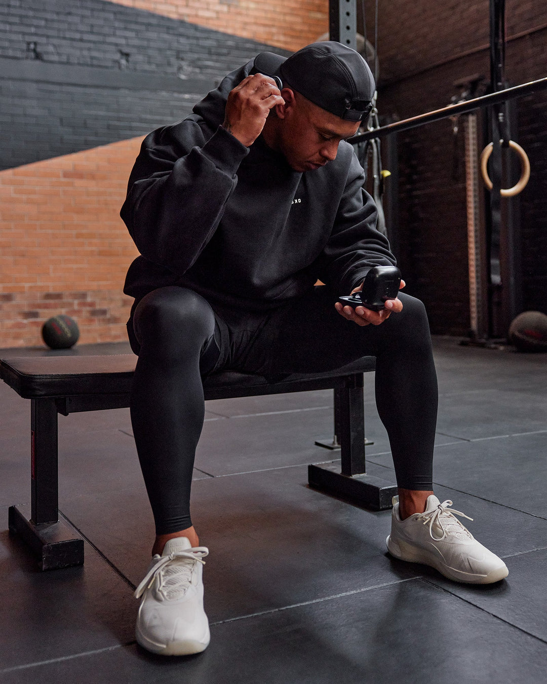 Man wearing BaseTech 26" Leggings - Black | Model:Paris | Size:L