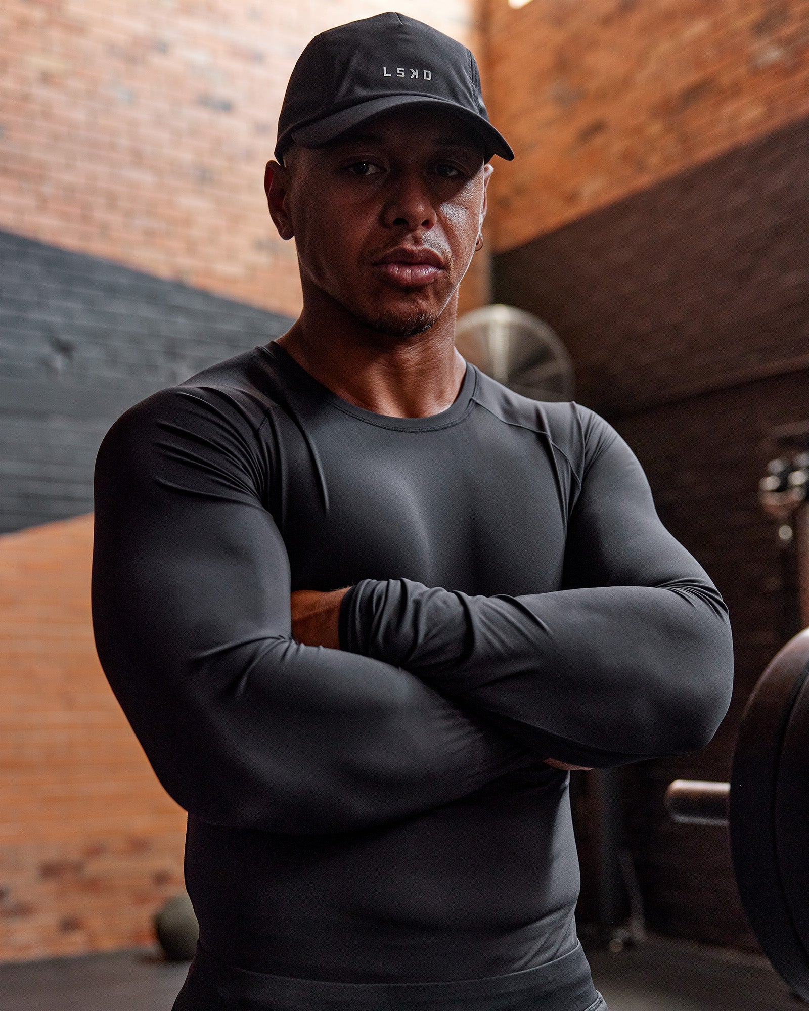 Man wearing BaseTech Long Sleeve Tee - Black | Model:Paris | Size:L