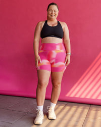 Woman wearing Fusion Ultra High-Rise 6" Short Pockets - Pink Glow Print | Size:L