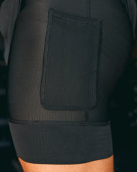 Man wearing Hybrid Lined 5" Short - Black-Reflective | Model:Nikola | Size:L