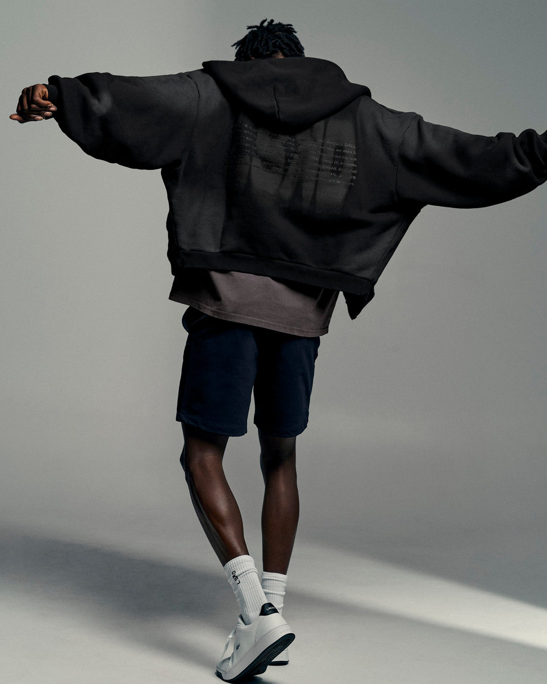 Man wearing Memory in Motion Ultra Heavyweight Zip Thru Hoodie - Black Washed | Model:Okello | Size:L