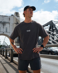 Man wearing Runner's FLXCotton Oversized Tee - Black Washed-White | Model:Kyal | Size:L