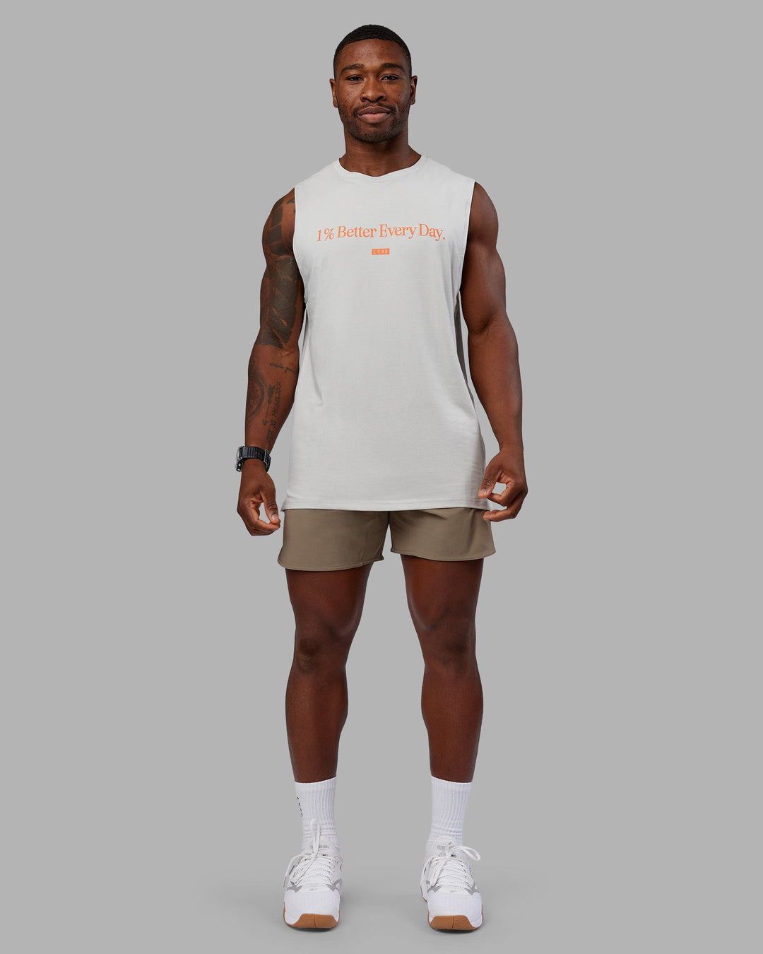 Man wearing 1% Better FLXCotton Training Fit Tank - Digital Mist-Ultra Orange | Model:Sam | Size:L