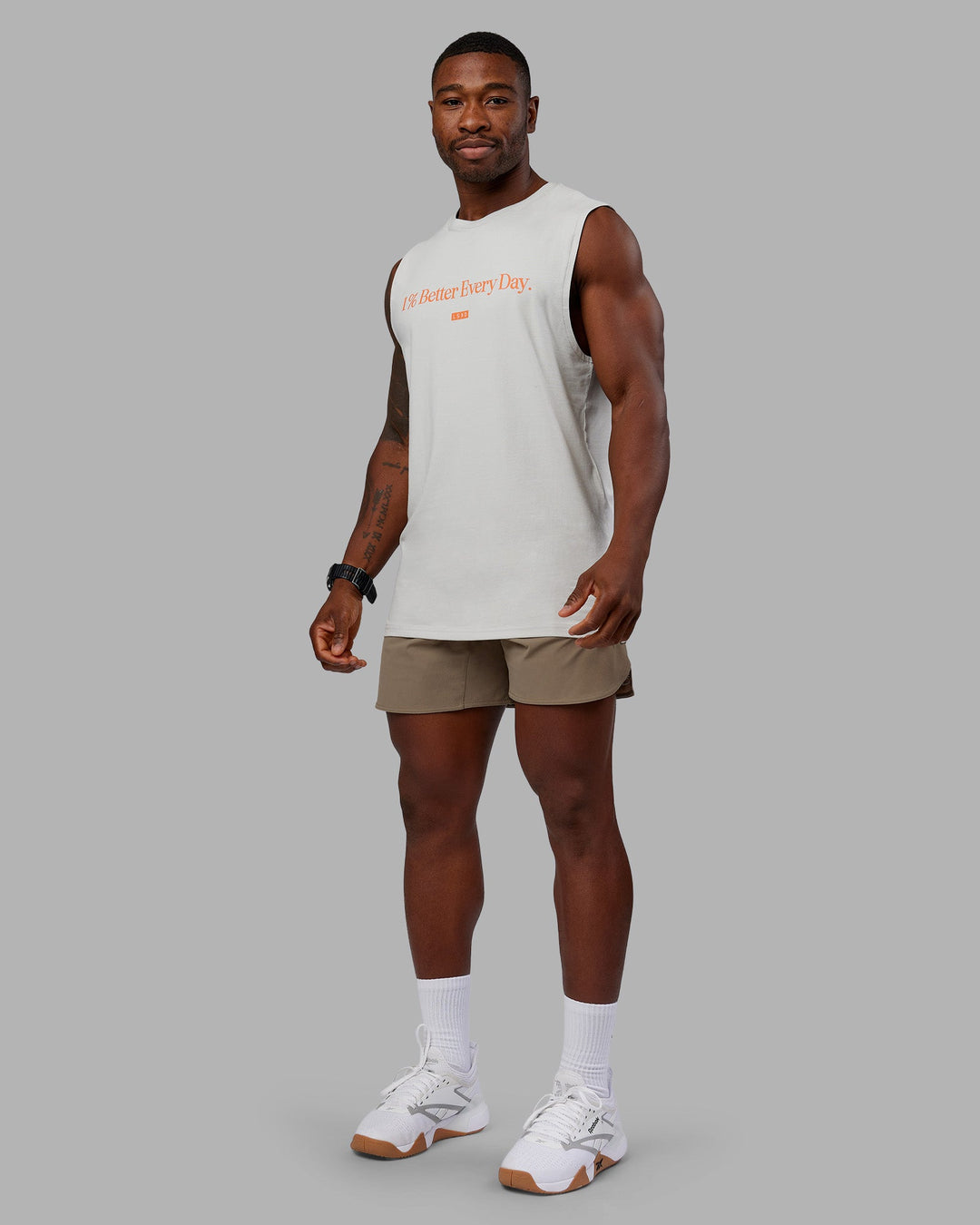 Man wearing 1% Better FLXCotton Training Fit Tank - Digital Mist-Ultra Orange | Model:Sam | Size:L