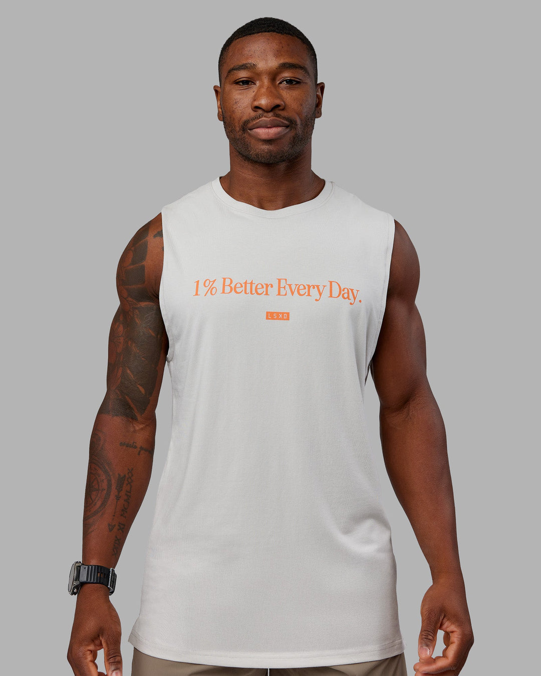 Man wearing 1% Better FLXCotton Training Fit Tank - Digital Mist-Ultra Orange | Model:Sam | Size:L