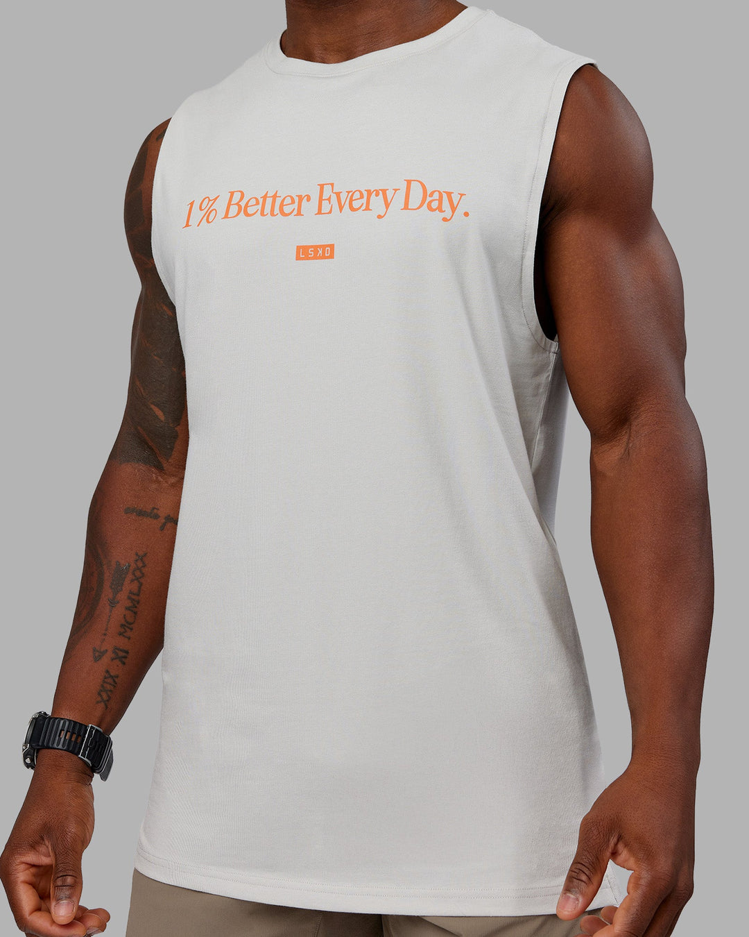 Man wearing 1% Better FLXCotton Training Fit Tank - Digital Mist-Ultra Orange | Model:Sam | Size:L
