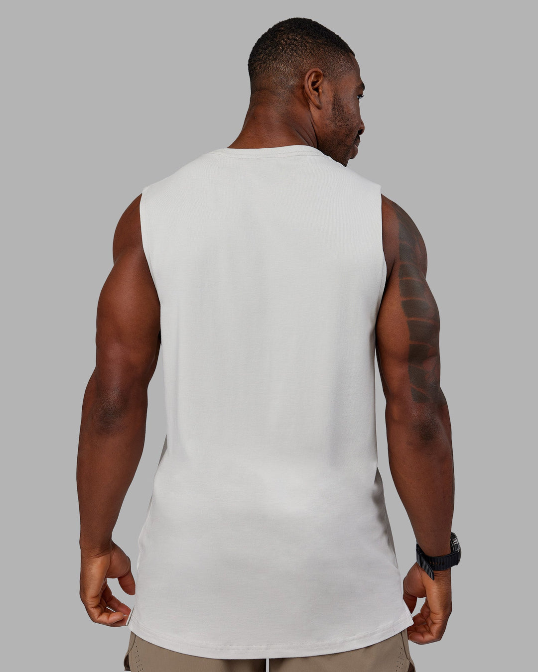 Man wearing 1% Better FLXCotton Training Fit Tank - Digital Mist-Ultra Orange | Model:Sam | Size:L