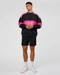 Man wearing A-Team Sweater Oversize - Caviar-Ultra Pink-Candy Pink | Model:Jackson | Size:L
