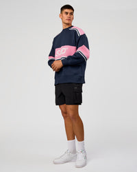 Man wearing A-Team Sweater Oversize - Future Navy-Candy Pink | Model:Jackson | Size:L