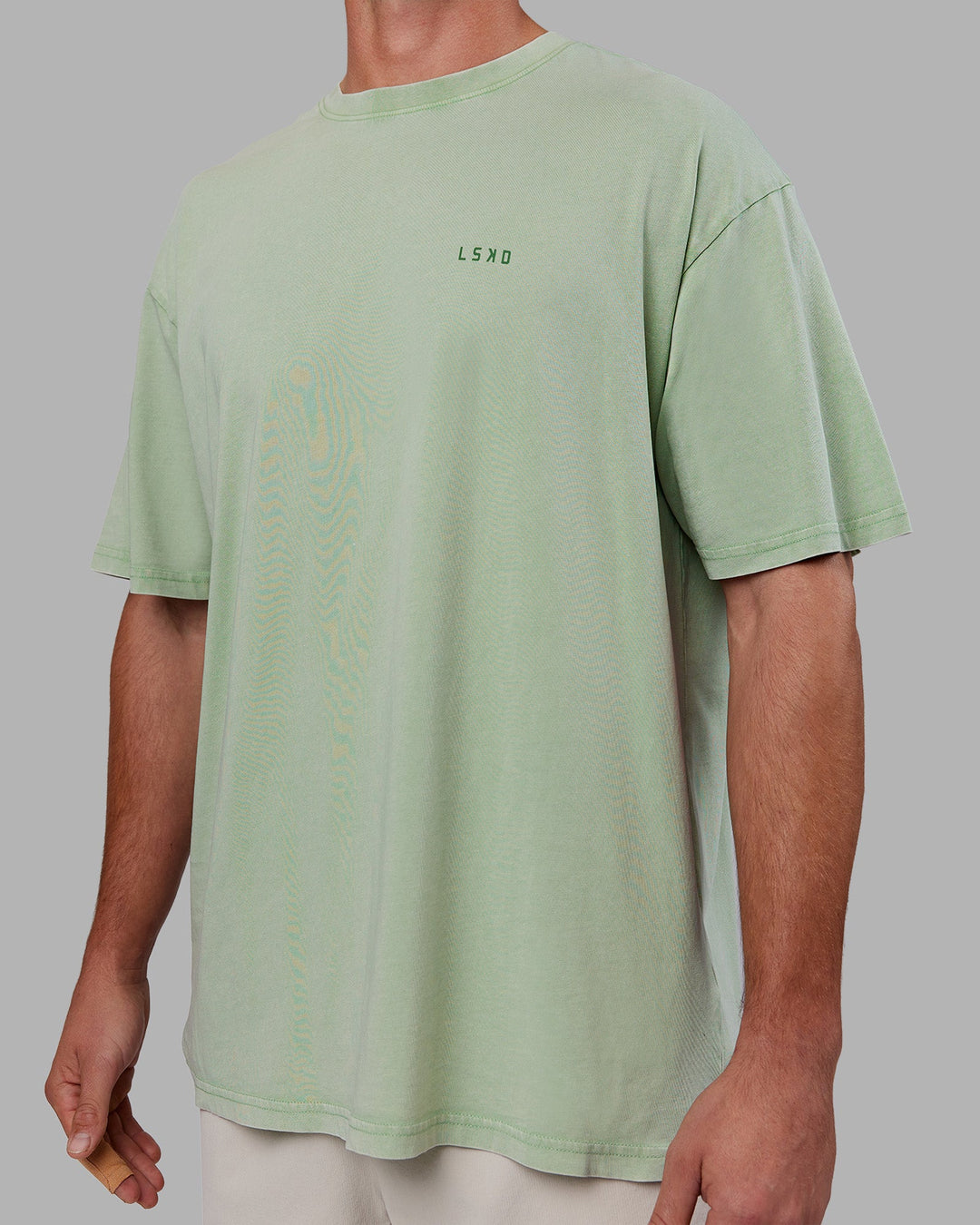 Man wearing Abs Unisex Growth FLXCotton Oversized Tee - Matcha Green Washed | Model:Fletcher | Size:L