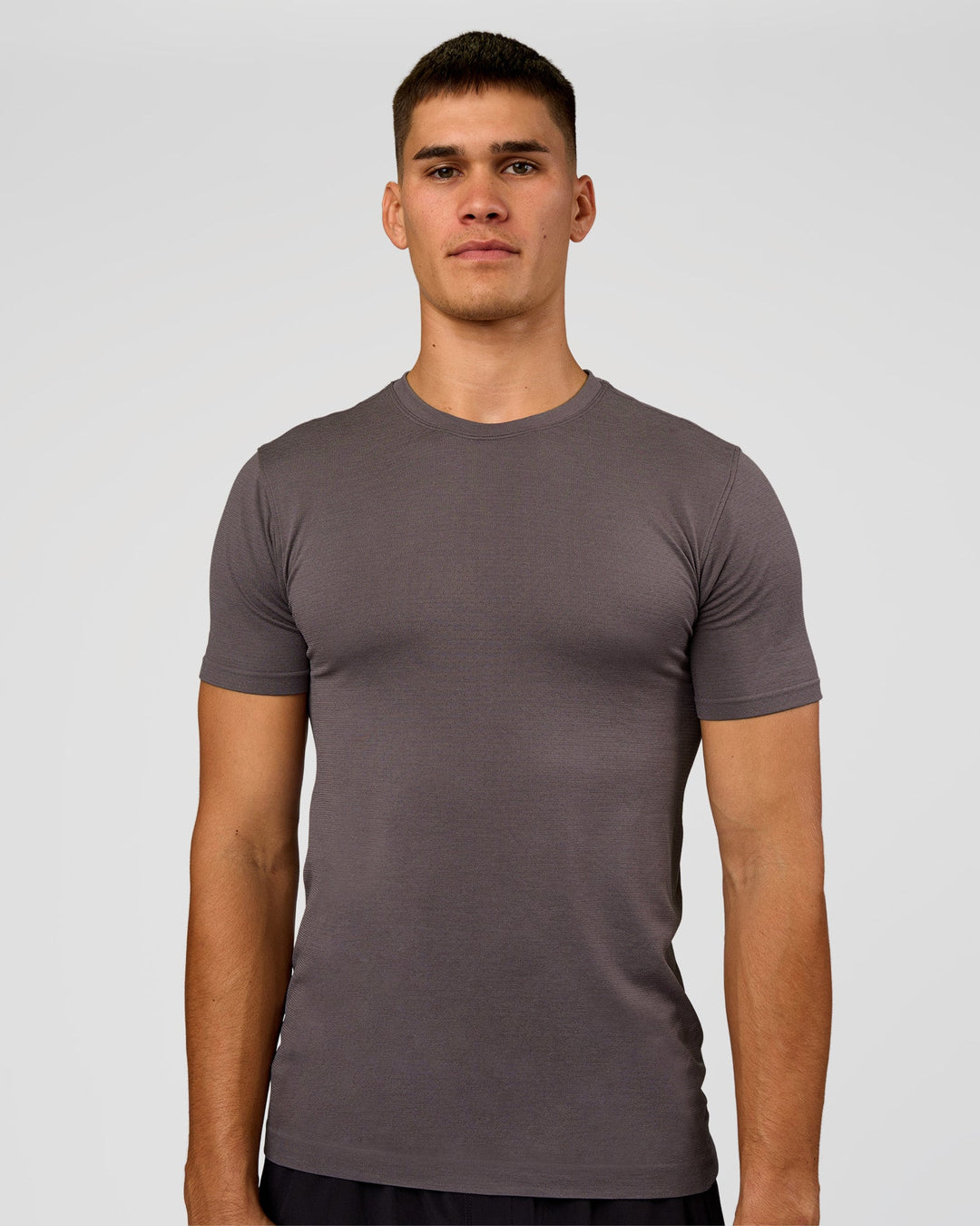 Man wearing AeroFLX+ Seamless Set In Tee - Duskstone/Duskstone | Model:Jackson | Size:L - view 1