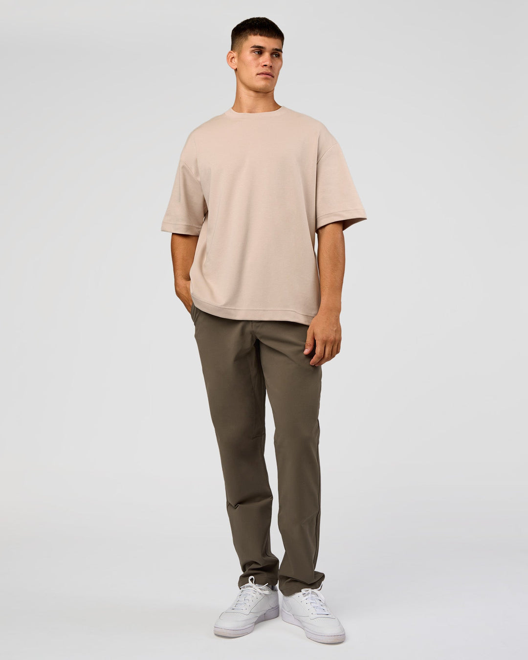 Man wearing AfterDark ZeroCrease Oversized Tee - Shale Beige | Model:Jackson | Size:L - view 10