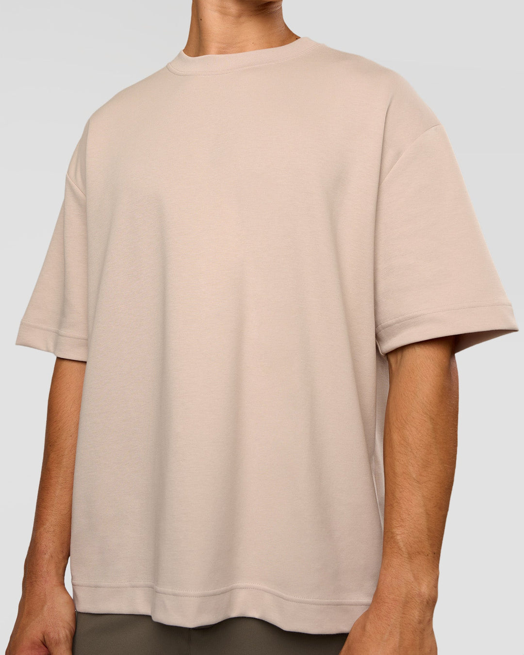 Man wearing AfterDark ZeroCrease Oversized Tee - Shale Beige | Model:Jackson | Size:L - view 7