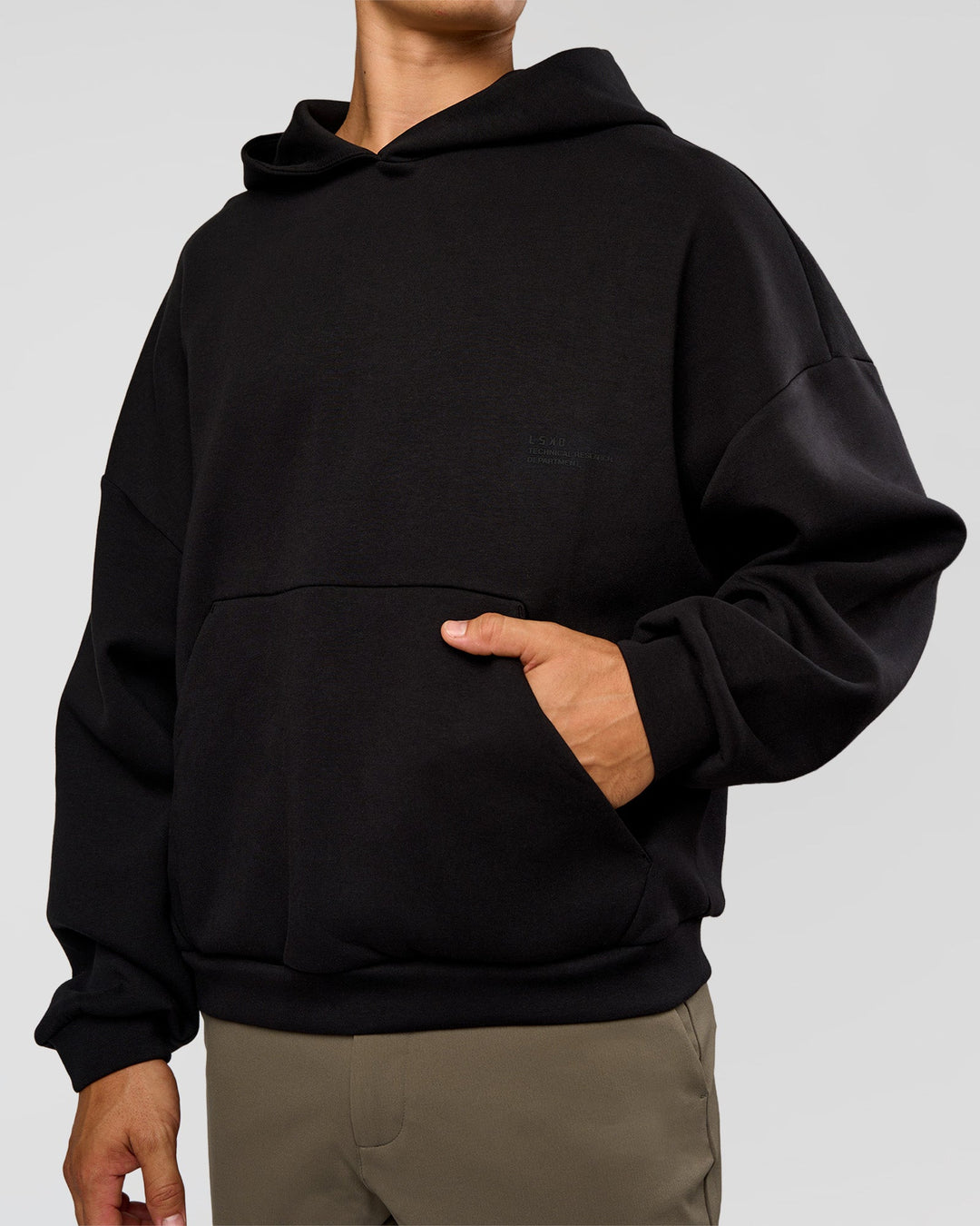 Man wearing AfterDark ZeroCrease Oversized Hoodie - Black | Model:Jackson | Size:L