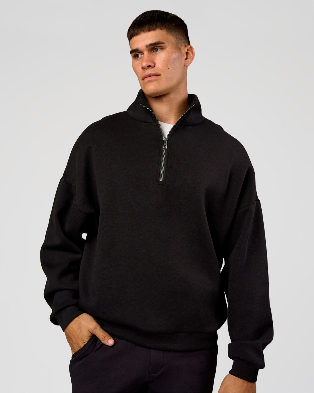 Man wearing AfterDark ZeroCrease Quarter Zip - Black | Model:Jackson | Size:L