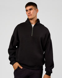 Man wearing AfterDark ZeroCrease Quarter Zip - Black | Model:Jackson | Size:L