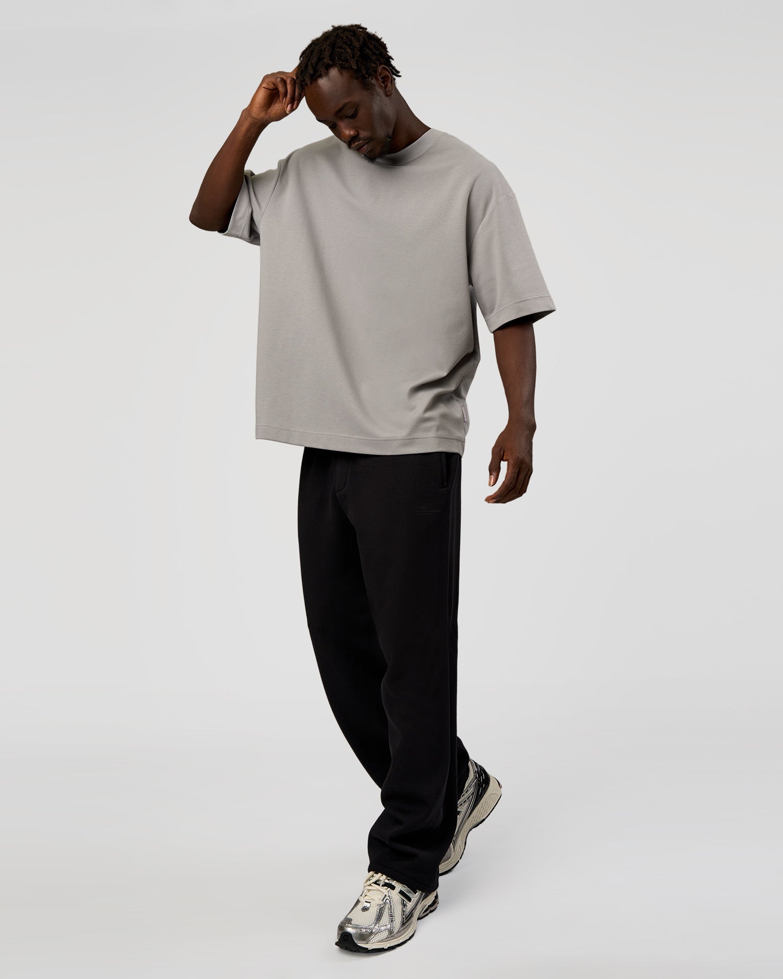 Man wearing AfterDark ZeroCrease Straight Leg Pant - Black | Model:Okello | Size:L