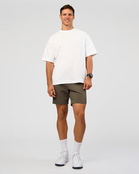 Man wearing All Day ZeroCrease™ Regular 8" Short - Walnut Grey | Model:Liam | Size:34