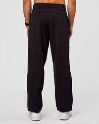 Man wearing All Day ZeroCrease™ Wide Leg Pant - Black | Model:Liam | Size:34