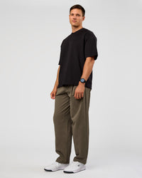 Man wearing All Day ZeroCrease™ Wide Leg Pant - Walnut Grey | Model:Liam | Size:L