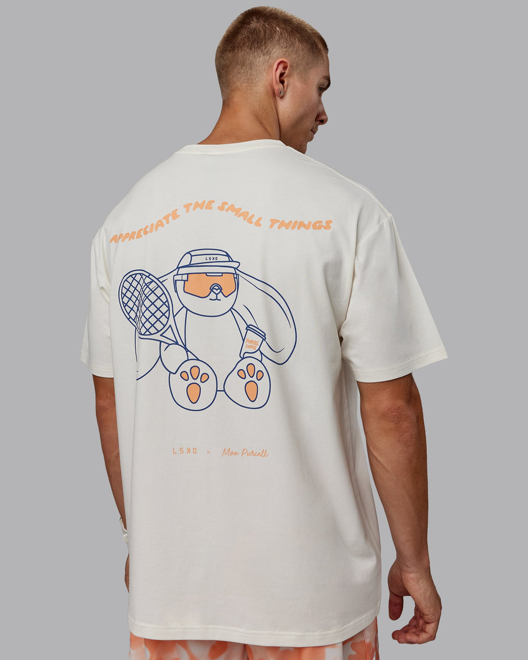 Man wearing Appreciate the Small Things FLXCotton Oversized Tee in Off White-Cantaloupe | Size:L