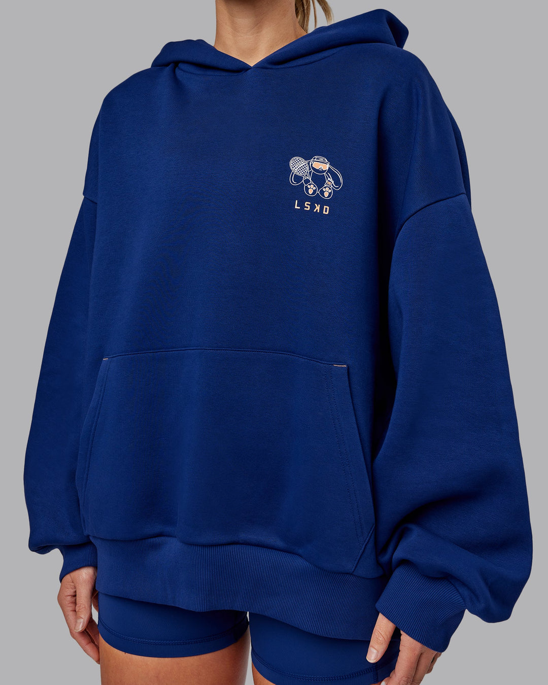 Woman wearing Unisex Appreciate the Small Things Oversized Hoodie in Midnight Blue | Size:L