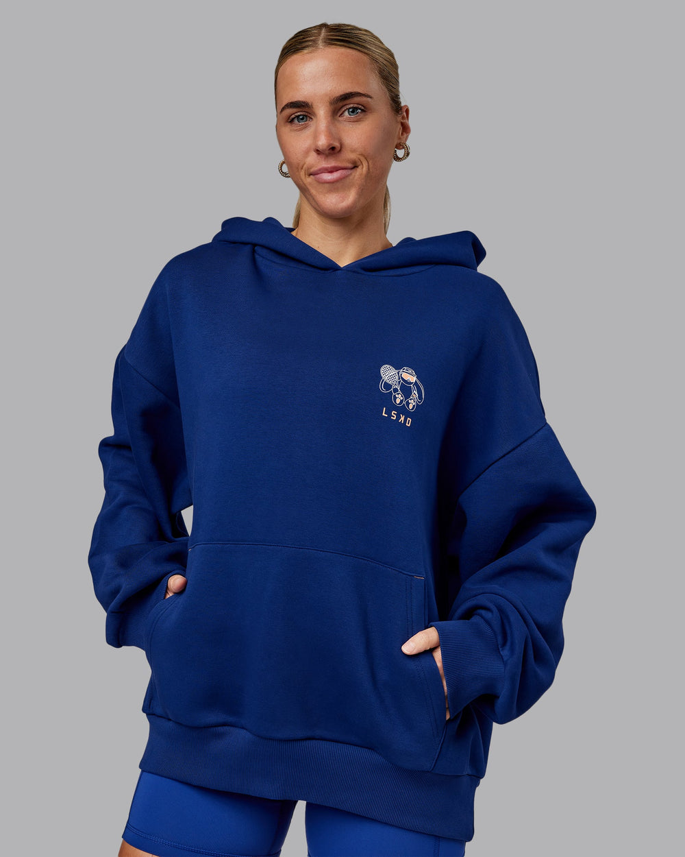 Woman wearing Unisex Appreciate the Small Things Oversized Hoodie in Midnight Blue | Size:L